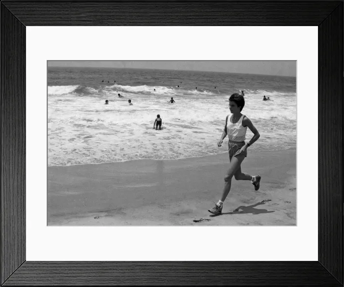 Framed Print : The 1984 Summer Olympics in Los Angeles. Wendy Sly running on Manhattan Beach, California Framed Print : The 1984 Summer Olympics in Los Angeles. Wendy Sly running on Manhattan Beach, California
