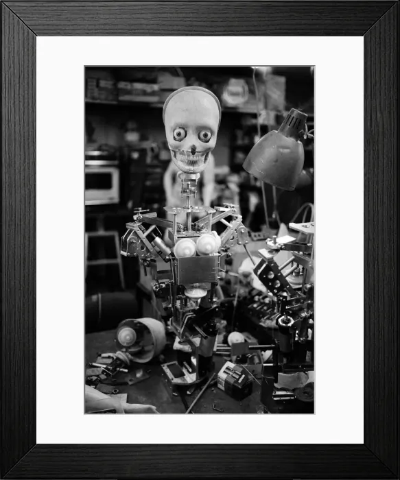 Framed Print : A robot skull awaits the parts which will complete its human look. Japan