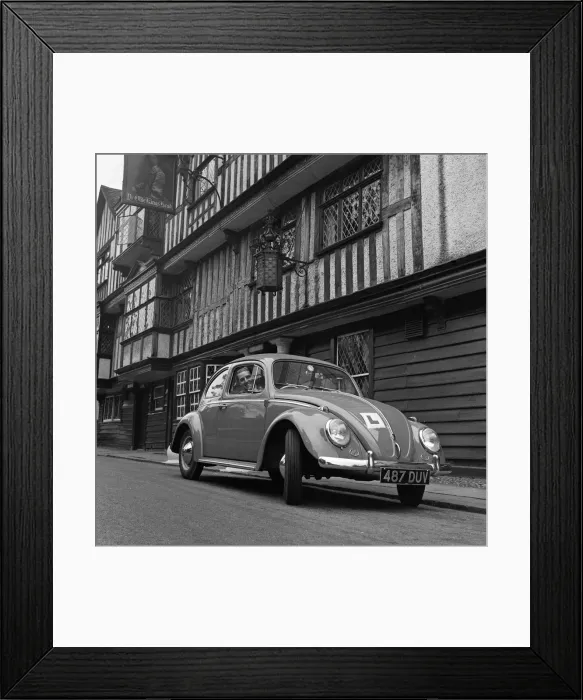 Framed Print : Learner driver in a Volkswagen Beetle. May 1962 Framed Print : Learner driver in a Volkswagen Beetle. May 1962