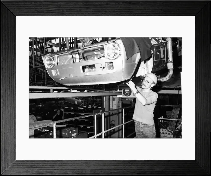 Framed Print : Volkswagen assembly line worker Peter Schredewitz at work in Wolfsburg, Germany