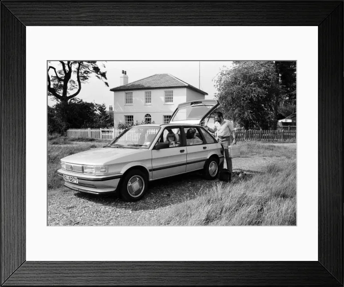 Framed Print : A man, woman and girl with a MG Maestro. 8th June 1983 Framed Print : A man, woman and girl with a MG Maestro. 8th June 1983