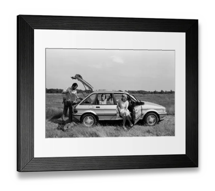 Framed Print : A man, woman and girl in a MG Maestro. 8th June 1983