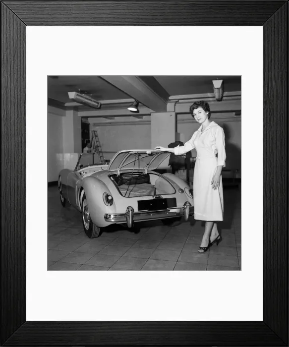 Framed Print : A new MG car on display in a showroom. 22nd September 1955 Framed Print : A new MG car on display in a showroom. 22nd September 1955