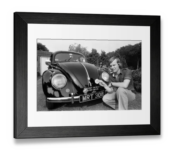 Framed Print : A man poses with a Volkswagen Beetle. 2nd June 1982 Framed Print : A man poses with a Volkswagen Beetle. 2nd June 1982