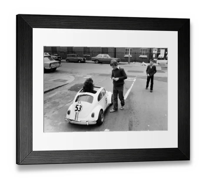 Framed Print : Sian Lloyd, who works at Walt Disney Productions, driving a replica of Herbie in Primrose Framed Print : Sian Lloyd, who works at Walt Disney Productions, driving a replica of Herbie in Primrose