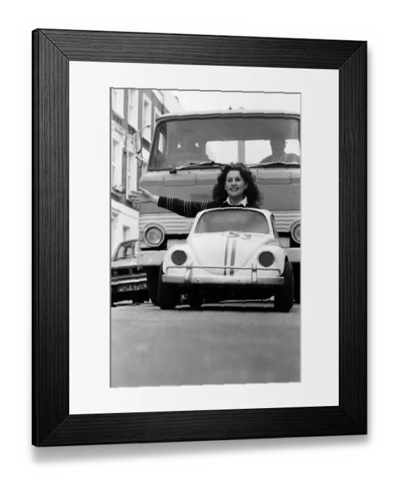 Framed Print : Sian Lloyd, who works at Walt Disney Productions, driving a replica of Herbie in Primrose Framed Print : Sian Lloyd, who works at Walt Disney Productions, driving a replica of Herbie in Primrose