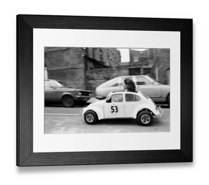 Framed Print : Sian Lloyd, who works at Walt Disney Productions, driving a replica of Herbie in Primrose