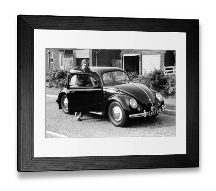 Framed Print : A man poses with a Volkswagen Beetle. 2nd June 1982 Framed Print : A man poses with a Volkswagen Beetle. 2nd June 1982