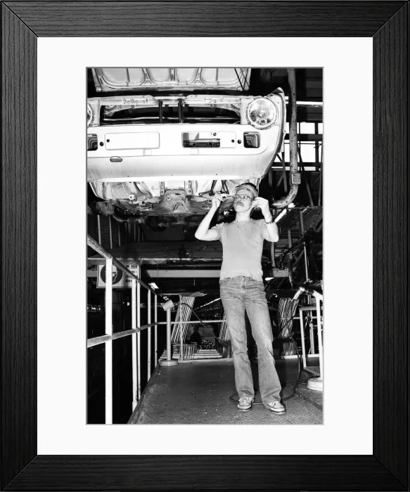Framed Print : Volkswagen assembly line worker Peter Schredewitz at work in Wolfsburg, Germany