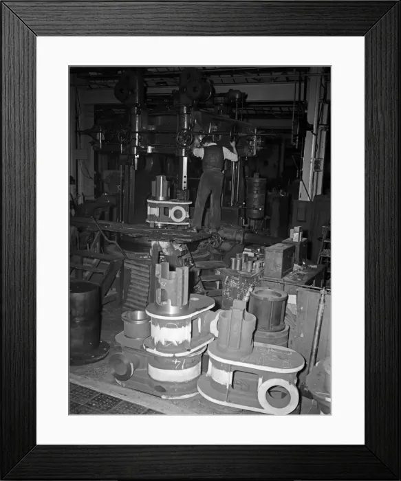 Framed Print : Components for the construction of mobile cranes seen here being manufactured