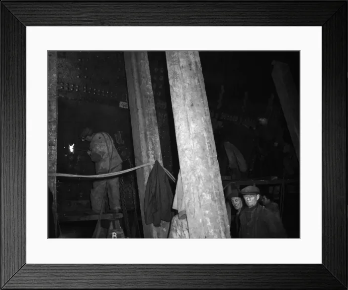 Framed Print : Shipbuilders at the King George V dry dock in Southampton replace damaged hull plates of Framed Print : Shipbuilders at the King George V dry dock in Southampton replace damaged hull plates of