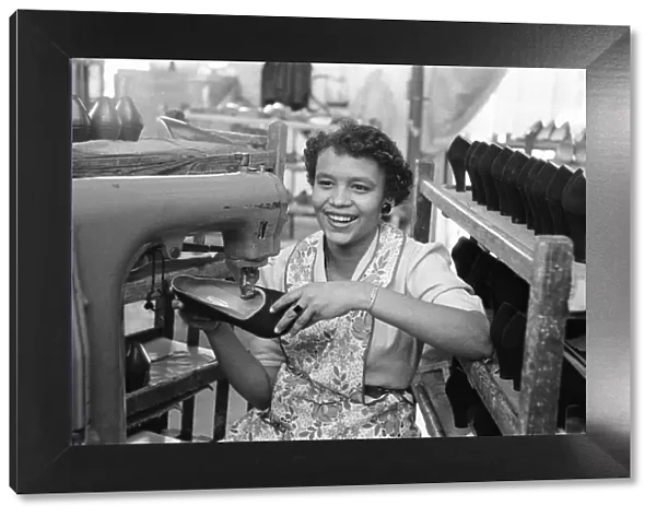Stitching a upper of a shoe at the H Solomons shoe factory in Tottenham. 30th July 1956