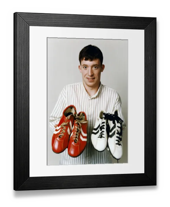 Framed Print : Liverpool teenage sensation Robbie Fowler with 2 pairs of football boots