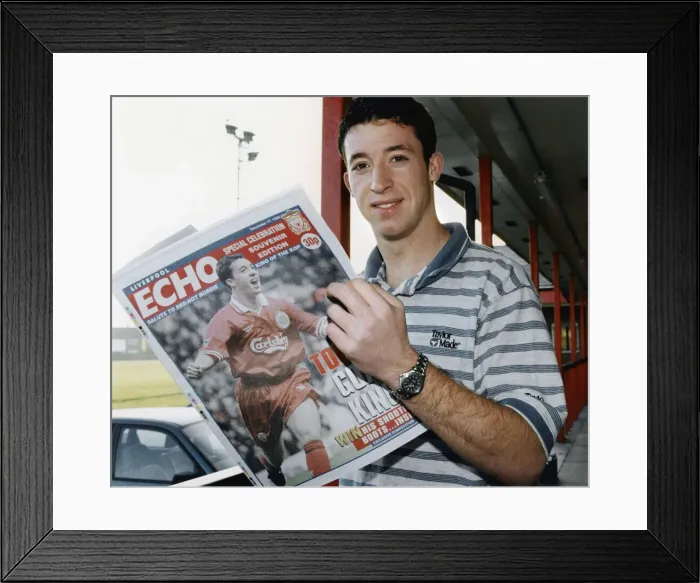 Framed Print : Liverpool striker Robbie Fowler reading the Liverpool Echo Special Celebration Souvenir
