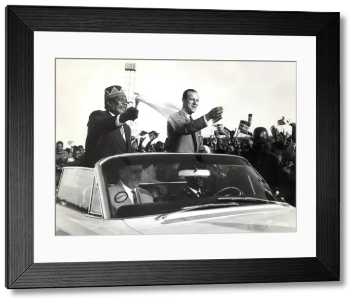 Framed Print : The Prime minister of Kenya, Jomo Kenyatta drives through a crowd of people while