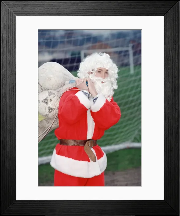 Framed Print : Liverpool striker Robbie Fowler dressed as Farther Christmas. 19th December 1995 Framed Print : Liverpool striker Robbie Fowler dressed as Farther Christmas. 19th December 1995