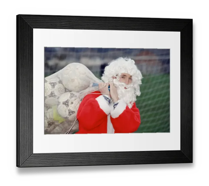 Framed Print : Liverpool striker Robbie Fowler dressed as Farther Christmas. 19th December 1995