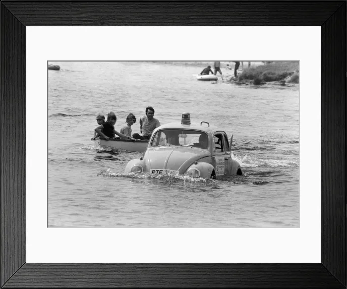 Framed Print : Malcolm Buchanan and Bill Helmeage who have spent the last month making a VW watertight