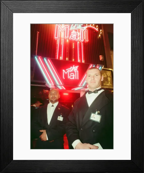 Framed Print : Paul Massey (right) and Ali Johnson, door staff at The Mall nightclub, High street Framed Print : Paul Massey (right) and Ali Johnson, door staff at The Mall nightclub, High street