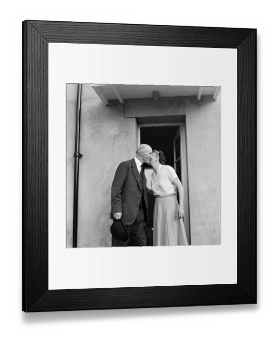 Framed Print : Lord Denning kisses his wife at their home in Whitchurch before leaving for London to Framed Print : Lord Denning kisses his wife at their home in Whitchurch before leaving for London to