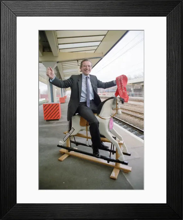 Framed Print : Employment Secretary, Norman Fowler, on a rocking horse Framed Print : Employment Secretary, Norman Fowler, on a rocking horse