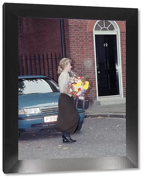 Therese Lawson with flowers. On the day Nigel and Therese Lawson move out of Downing