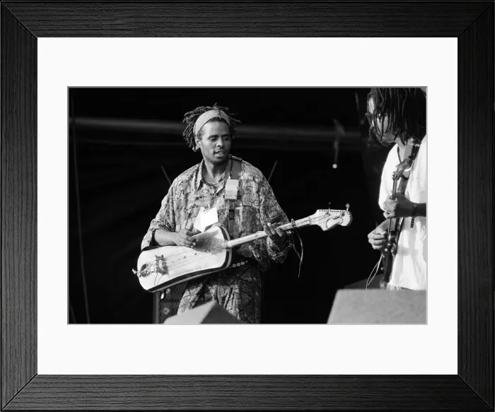 Framed Print : Hassan Hakmoun performing at WOMAD festival at Rivermead in Reading, Berkshire