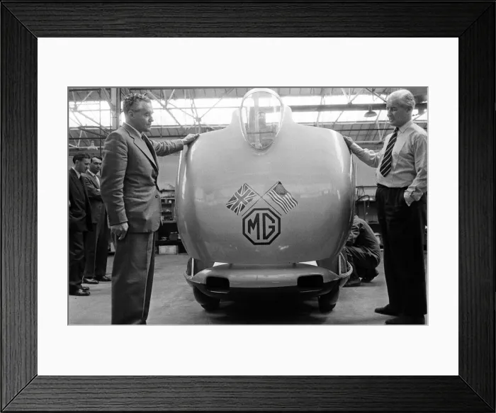 Framed Print : Men, including Syd Enever and Tommy Wisdom looking at the MG EX181 which is being worked Framed Print : Men, including Syd Enever and Tommy Wisdom looking at the MG EX181 which is being worked