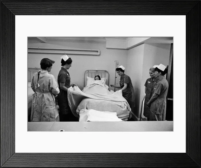 Framed Print : Nurses training with their dummy patient. This is for the future hospital which will be Framed Print : Nurses training with their dummy patient. This is for the future hospital which will be