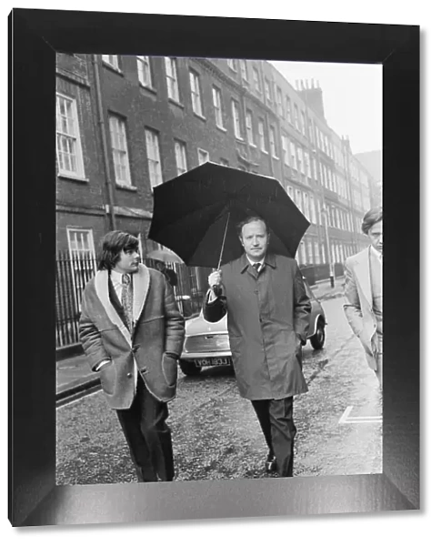 Mr James Douglas Spooner, pictured holding his umbrella
