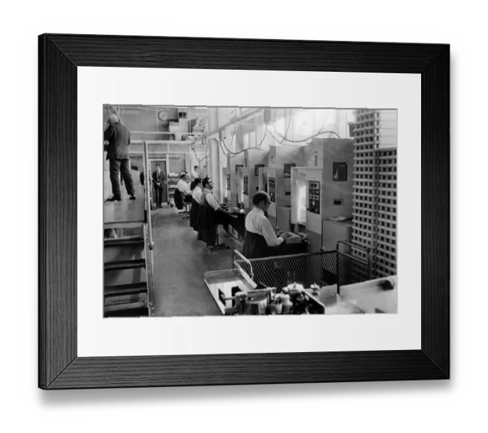 Framed Print : The scene at Newport Sorting Office, showing rows of coding machines and their operators Framed Print : The scene at Newport Sorting Office, showing rows of coding machines and their operators