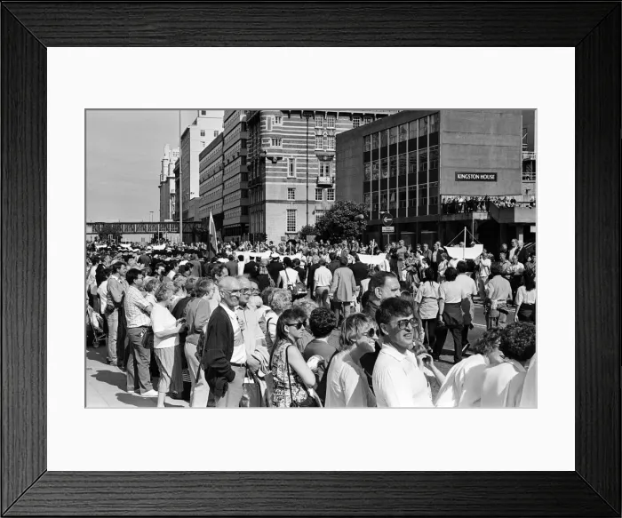 Framed Print : Crowds of people line the dock road set for a day out at Liverpool Albert Dock to see Framed Print : Crowds of people line the dock road set for a day out at Liverpool Albert Dock to see