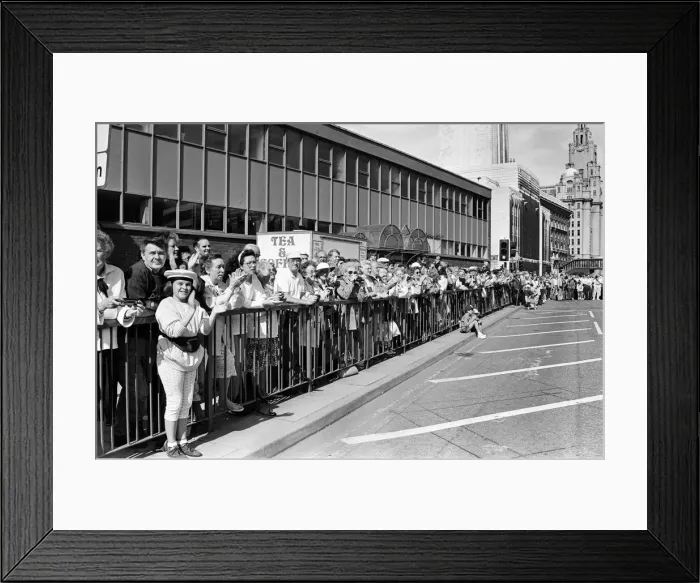 Framed Print : Crowds of people line the dock road set for a day out at Liverpool Albert Dock to see Framed Print : Crowds of people line the dock road set for a day out at Liverpool Albert Dock to see