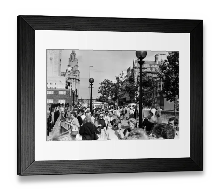 Framed Print : Crowds of people line the dock road set for a day out at Liverpool Albert Dock to see