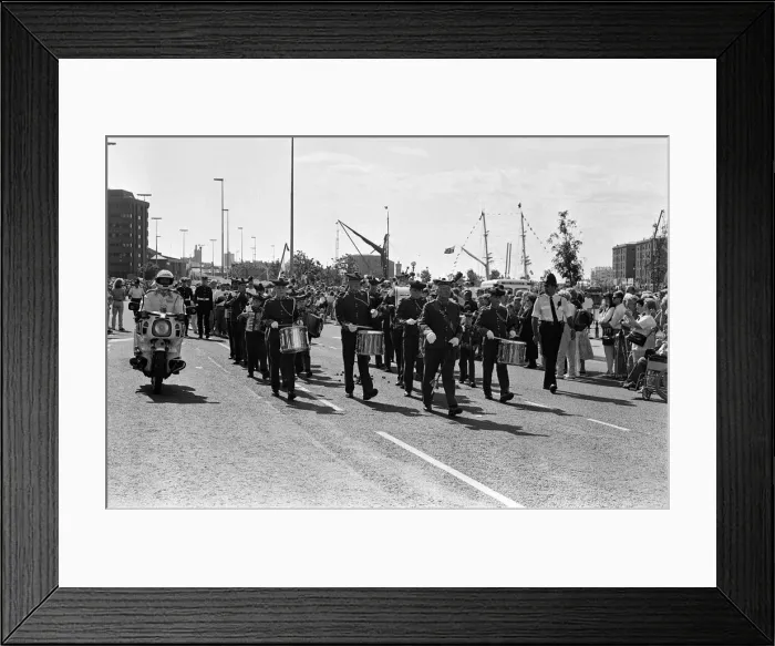 Framed Print : Crowds of people line the dock road set for a day out at Liverpool Albert Dock to see Framed Print : Crowds of people line the dock road set for a day out at Liverpool Albert Dock to see