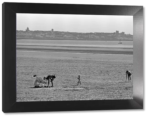 People enjoying a day at Crosby beach. Crosby, Merseyside. 1st August 1990