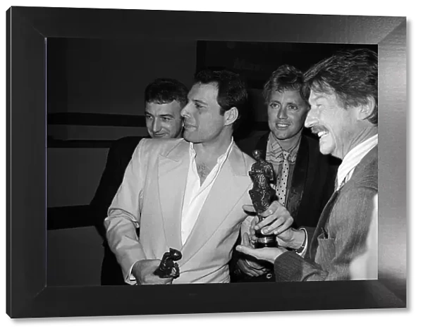The Ivor Novello Awards. Pictured, John Deacon, Freddie Mercury