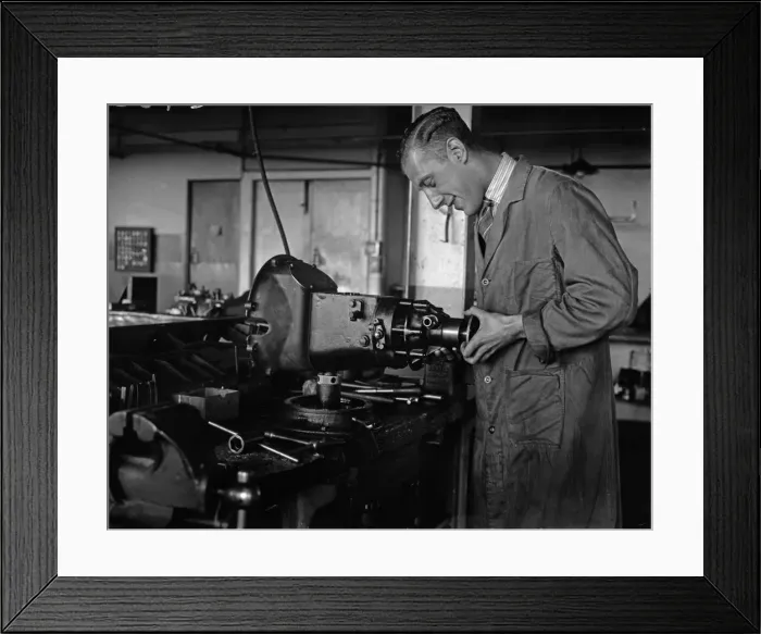 Framed Print : Worker assembling a gearbox in the Triumph car factory in Coventry. 23rd September 1931