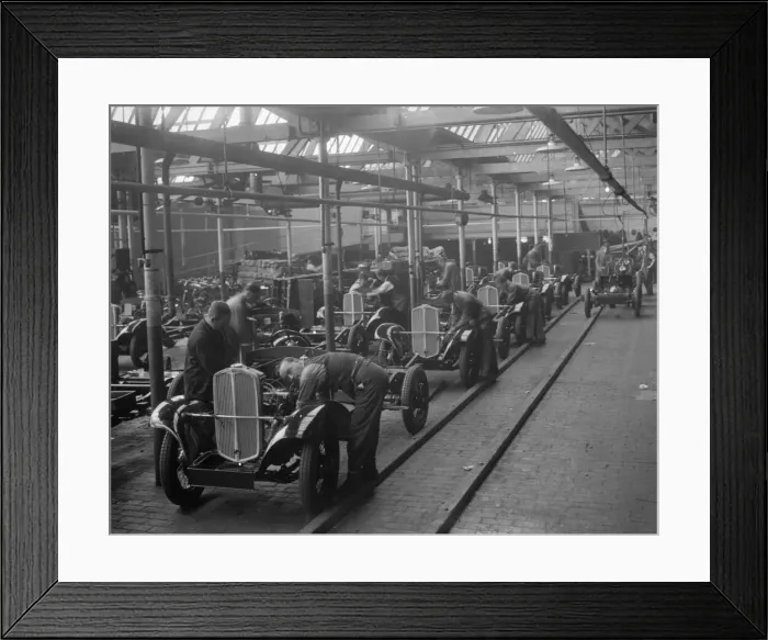 Framed Print : Production line at the Triumph car factory in Coventry. 23 September 1931 Framed Print : Production line at the Triumph car factory in Coventry. 23 September 1931