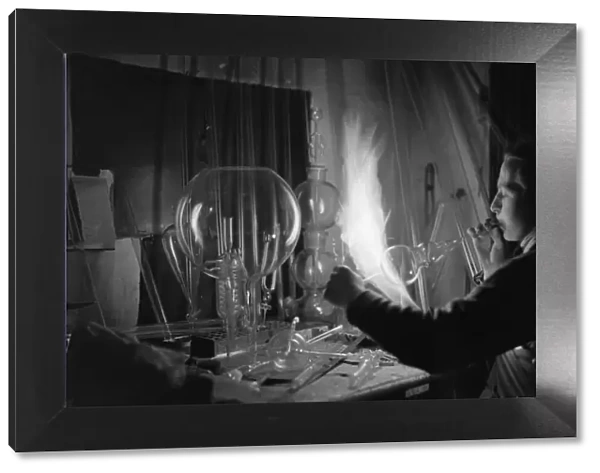 A employee of Scientific Supplies of Hatton Garden, seen here glass blowing
