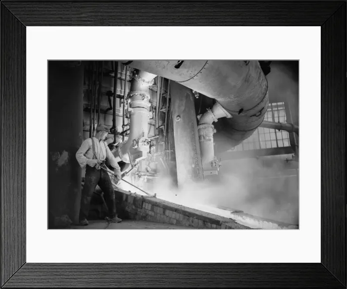 Framed Print : A worker checks the molten metal at the new one million pound furnace at Ford Framed Print : A worker checks the molten metal at the new one million pound furnace at Ford