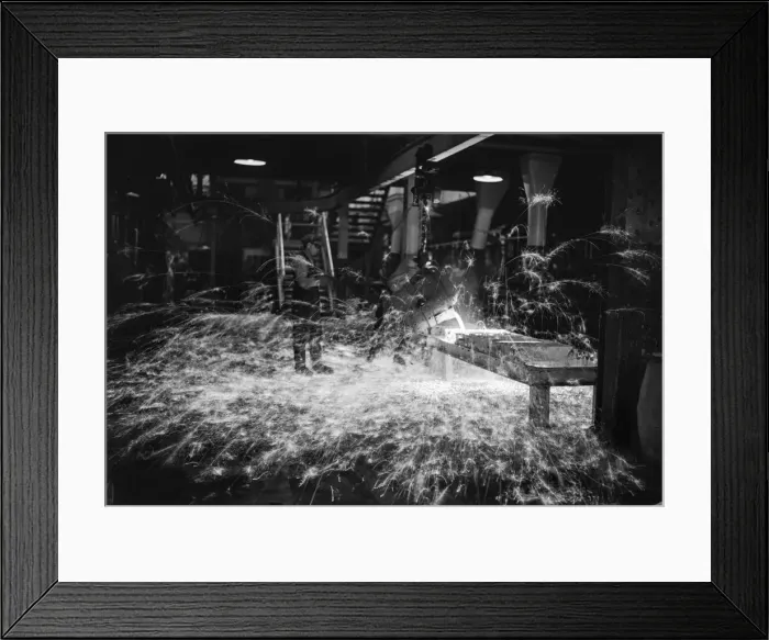 Framed Print : A worker casts components from molten metal at the new one million pound furnace Framed Print : A worker casts components from molten metal at the new one million pound furnace