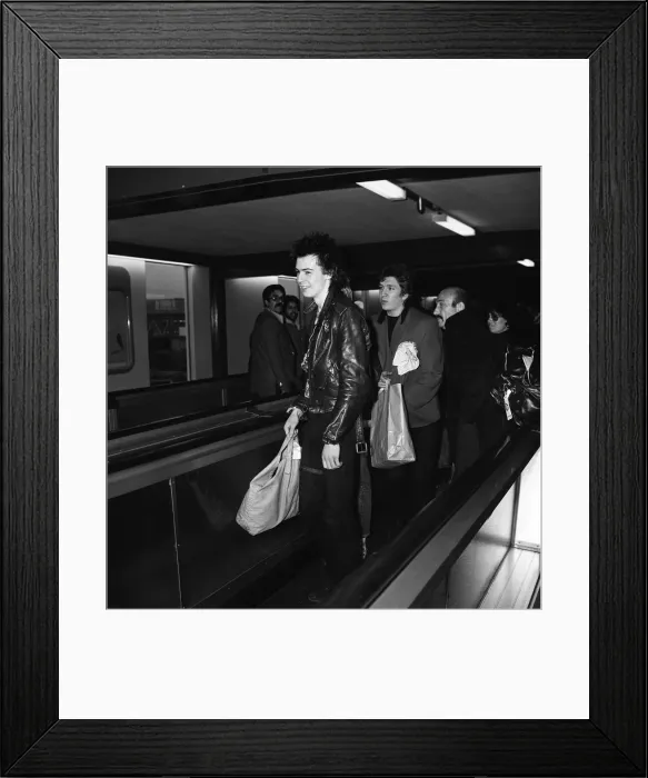 Framed Print : The Sex Pistols at Heathrow Airport before flying off for an American tour