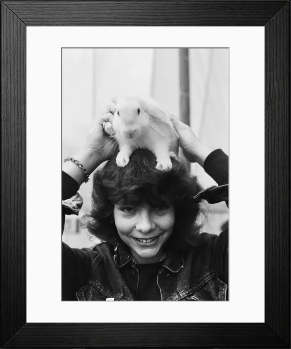 Framed Print : Reading show, in Reading Berkshire. (Picture) Girl at the show holding a rabbit Framed Print : Reading show, in Reading Berkshire. (Picture) Girl at the show holding a rabbit