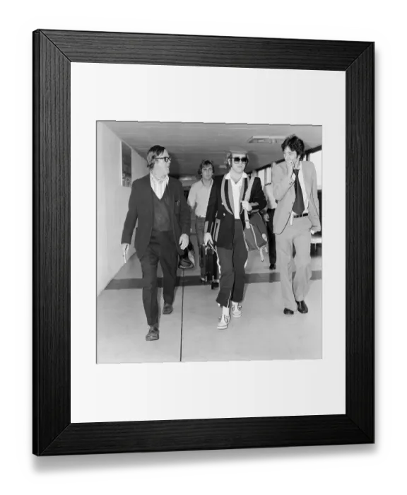 Framed Print : Elton John, departs London Heathrow, heading for Los Angeles. 26th June 1977 Framed Print : Elton John, departs London Heathrow, heading for Los Angeles. 26th June 1977