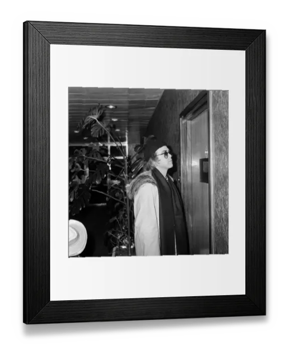 Framed Print : Elton John departing from Heathrow airport to New York for a recording session