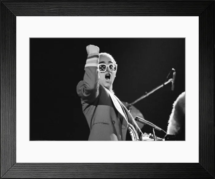 Framed Print : Pop star Elton John on stage at Earls Court, London. This is his first London concert Framed Print : Pop star Elton John on stage at Earls Court, London. This is his first London concert