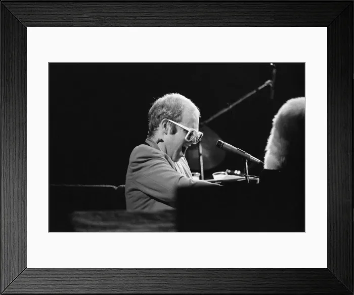 Framed Print : Pop star Elton John on stage at Earls Court, London. This is his first London concert Framed Print : Pop star Elton John on stage at Earls Court, London. This is his first London concert