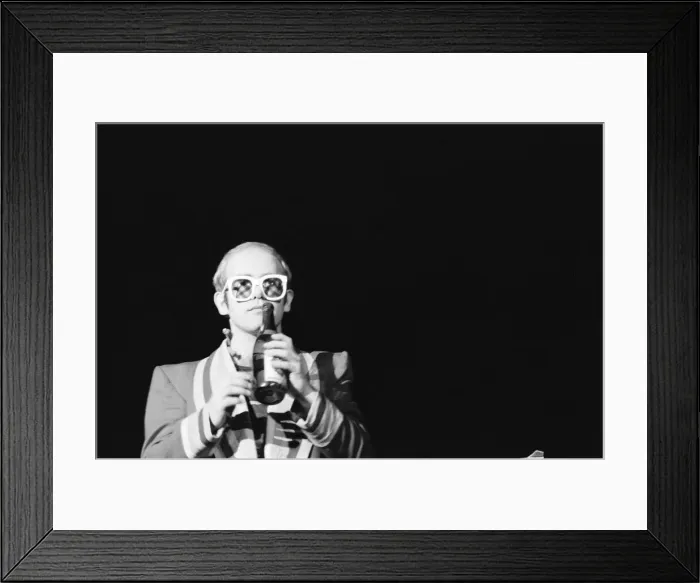 Framed Print : Pop star Elton John on stage at Earls Court, London. This is his first London concert