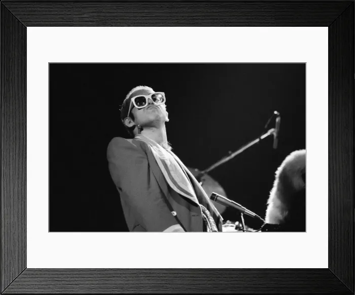 Framed Print : Pop star Elton John on stage at Earls Court, London. This is his first London concert Framed Print : Pop star Elton John on stage at Earls Court, London. This is his first London concert